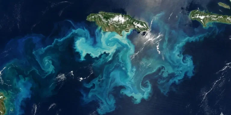 Satellite image showing a bright blue ocean sediment plume south of Jamaica caused by Hurricane Melissa stirring the seafloor