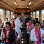 Elvis-themed train carrying Elvis Presley fans in costume traveling from Sydney to Parkes, Australia